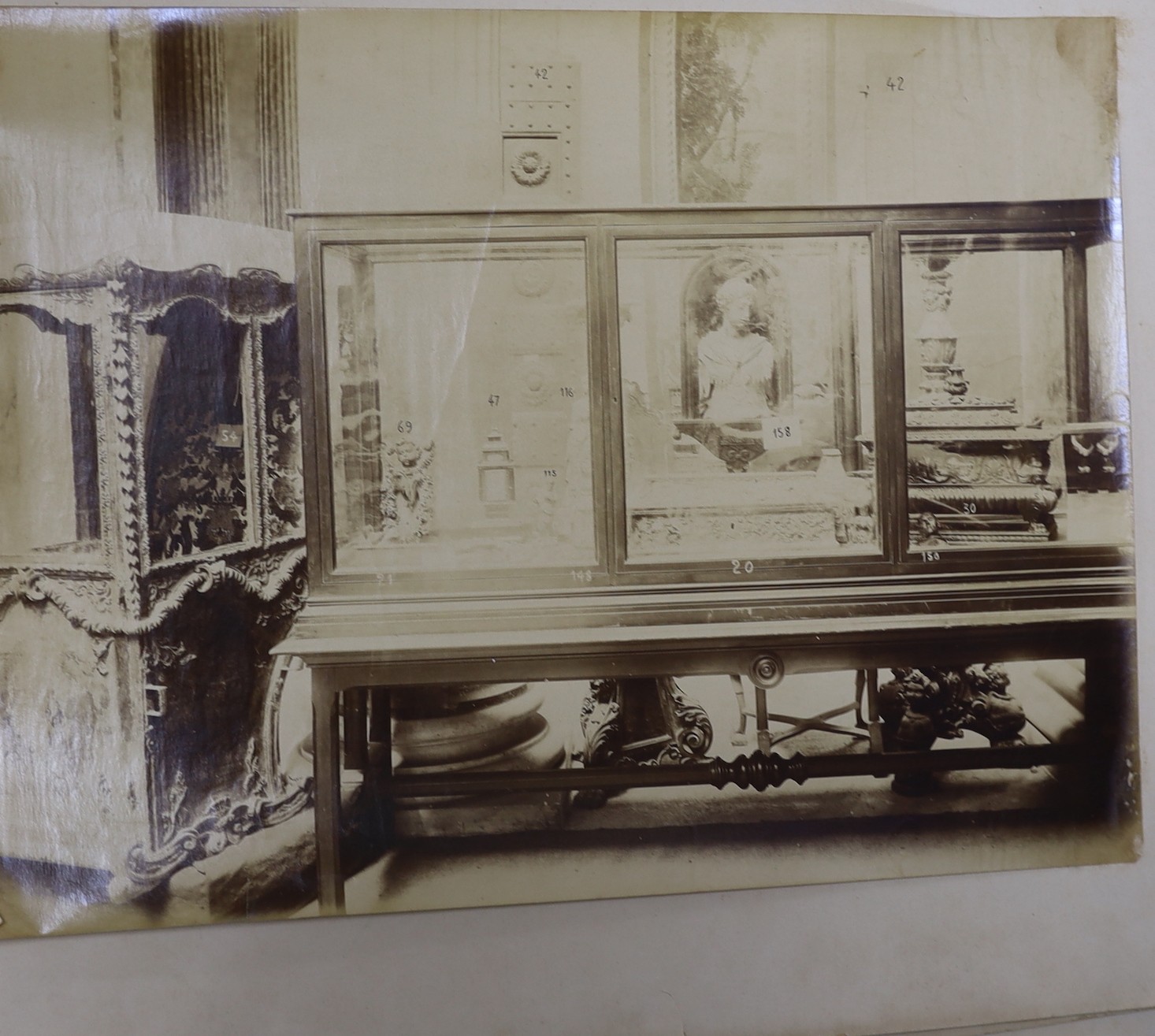 G. Borelli of Rome. A folio of photographs of antiquities and historical artefacts, together with an etching by Hedley Fitton, overall 49 x 38cm